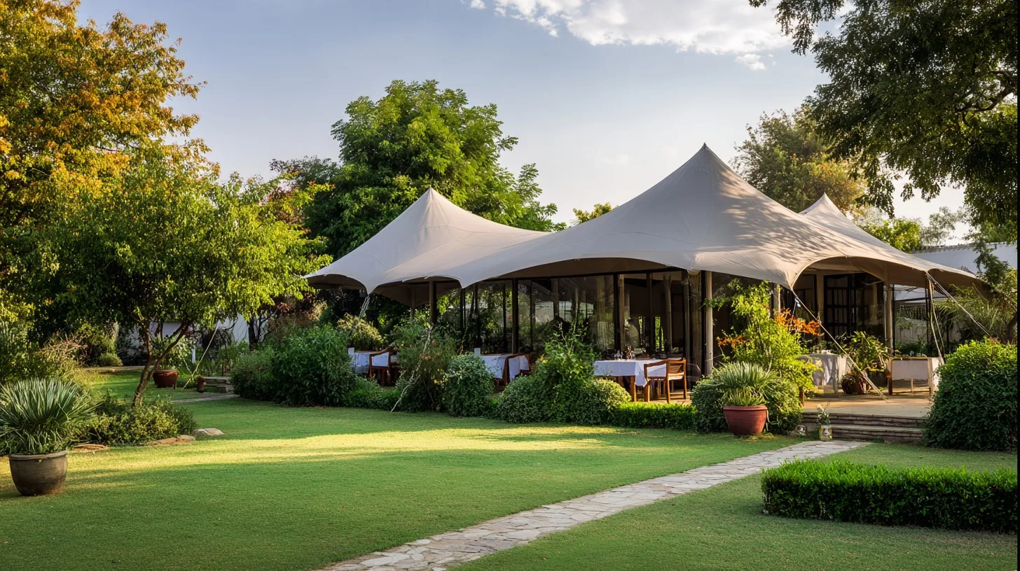 Tented dining structures set in the gardens at Mtalii Bush Camps